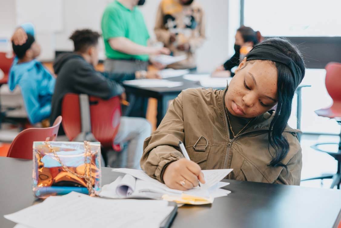 Uplift_student-working-at-desk